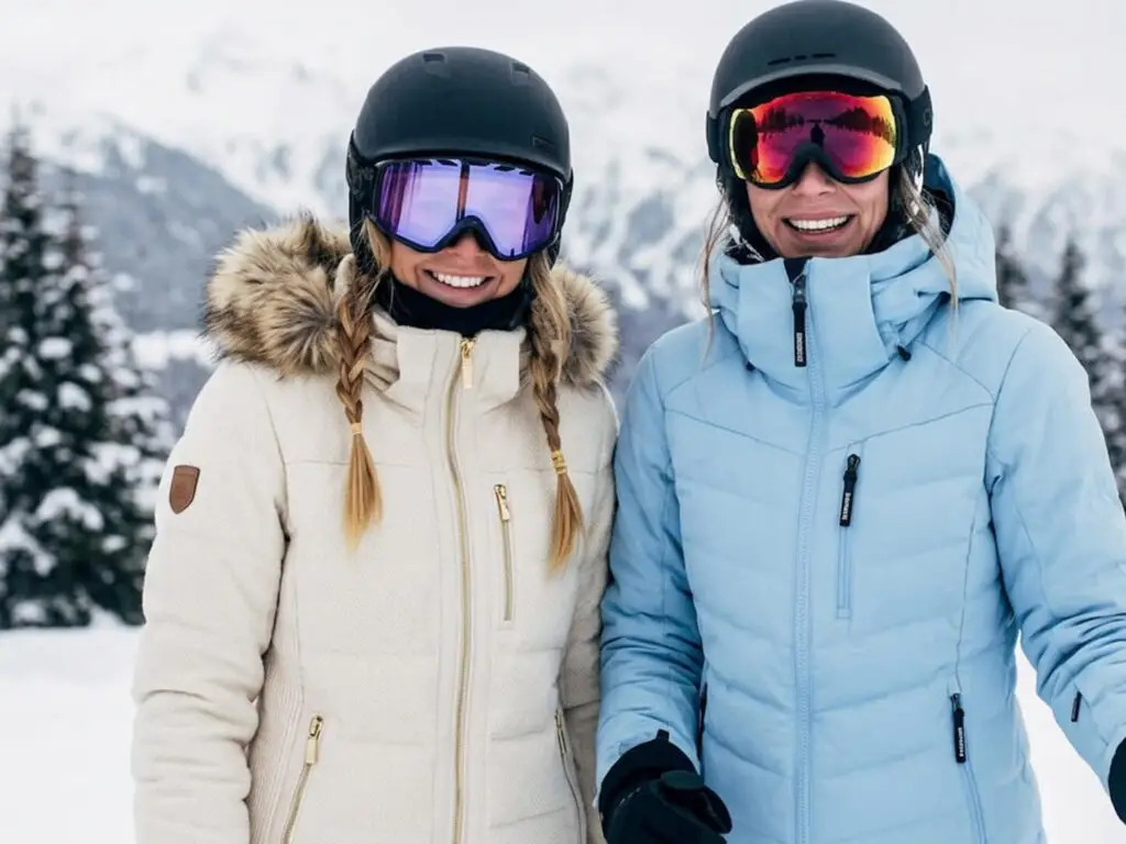 Skiers in clean winter ski jackets on the slopes